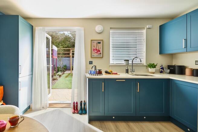 French doors keep the kitchen/diner light and airy