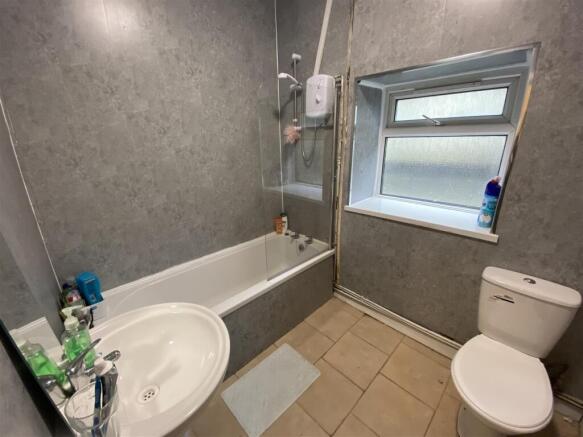 Bright bathroom with bathtub and shower....