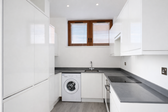 Modern L-shaped kitchen with appliances