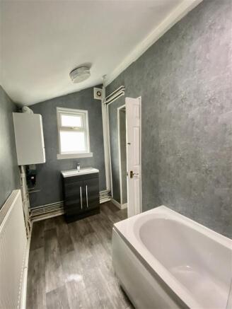 Modern bathroom suite with sleek grey finish...