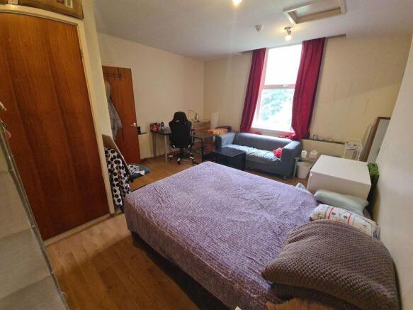 Bright, well-appointed double bedroom with two ...