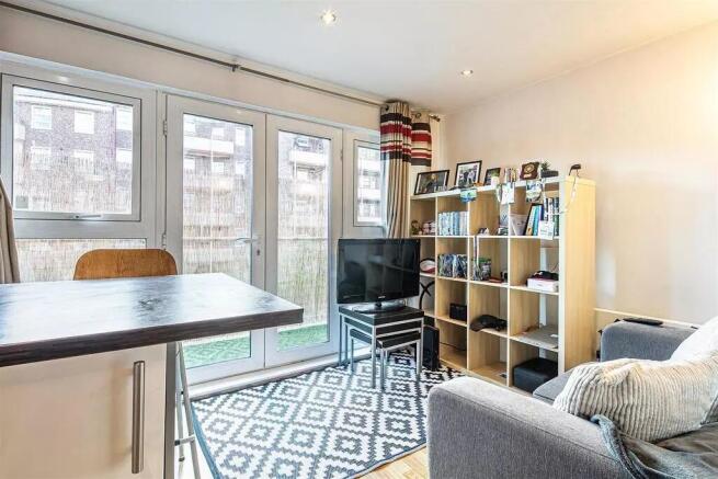 A bright and contemporary living room with larg...