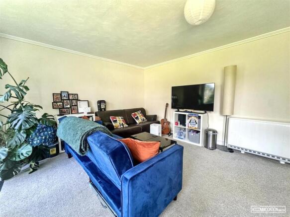 Bright, spacious lounge with comfy velvet sofa...