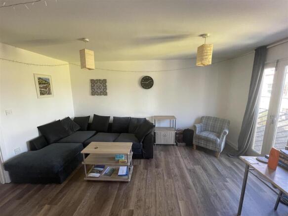 Spacious lounge with a large comfy corner sofa...