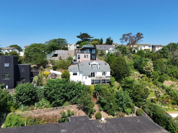 Aerial view of house and plot.