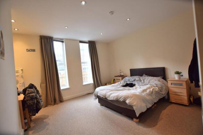 Bright, well-proportioned master bedroom with t...