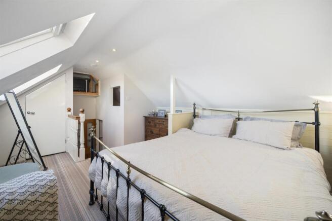 Bedroom Four to stairs.jpg