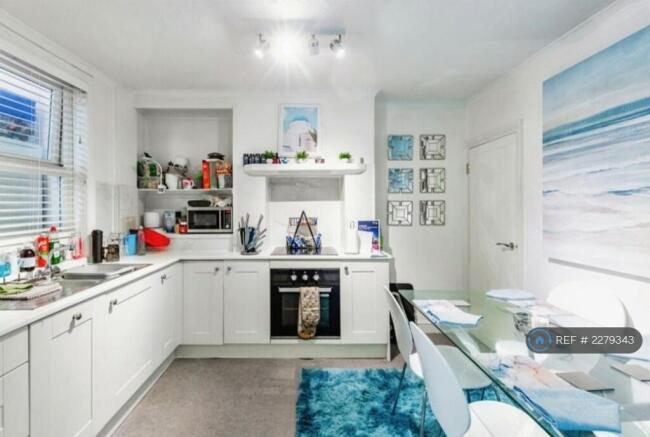 Kitchen Dinner With Door To Larder