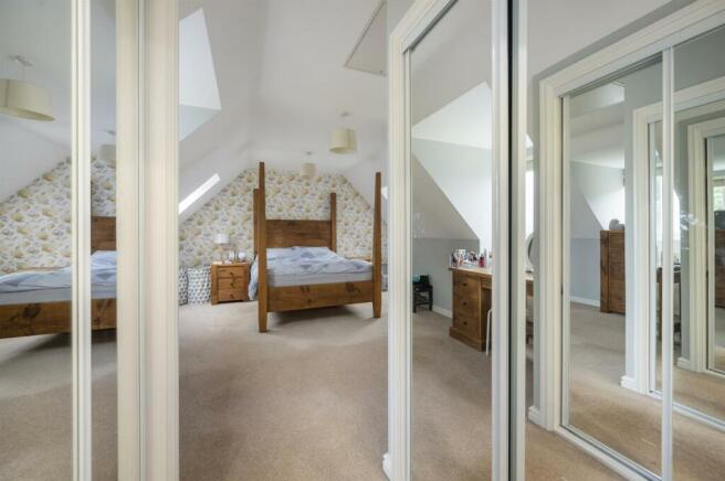 Bedroom Three - dressing area towards bedroom.jpg