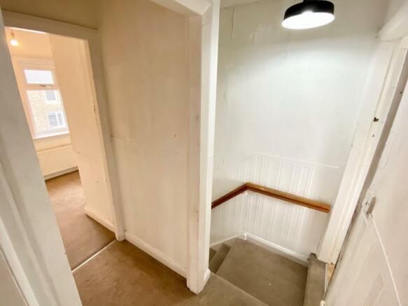 TO THE FIRST FLOOR LANDING