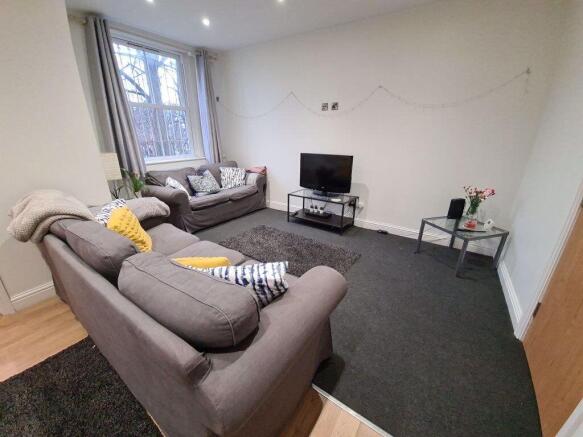 A bright and inviting contemporary living room ...