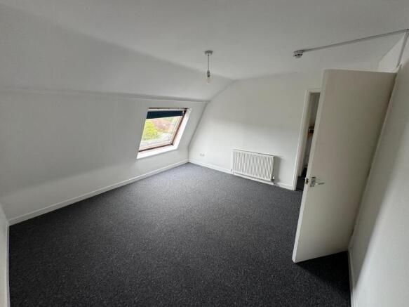 Bright, spacious attic room with fresh carpet...