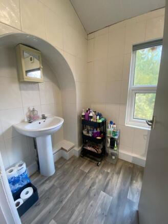 A bright and clean bathroom featuring a classic...