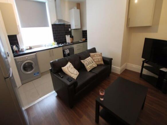 A cozy and well-maintained living room featurin...