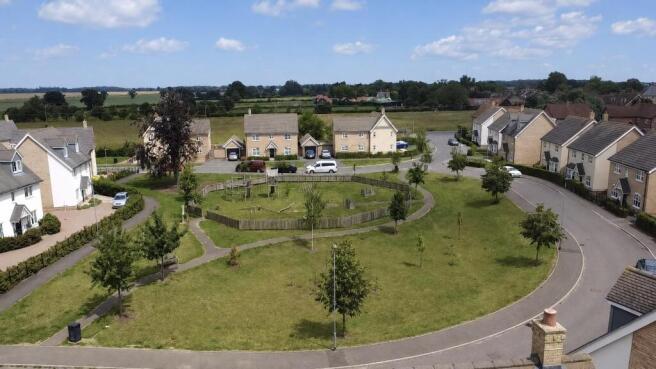 Green At Front Of Property & Surrounding Area