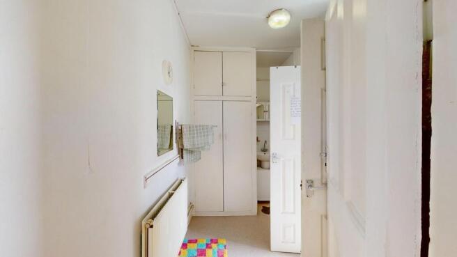 Bright hallway with useful built-in storage....