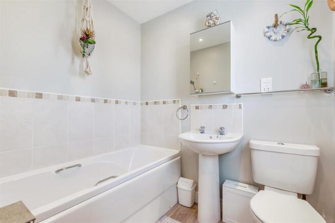Bathroom with separate shower over bath