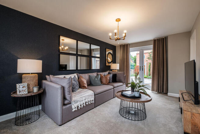 Lounge with dark blue wall and French doors to the garden