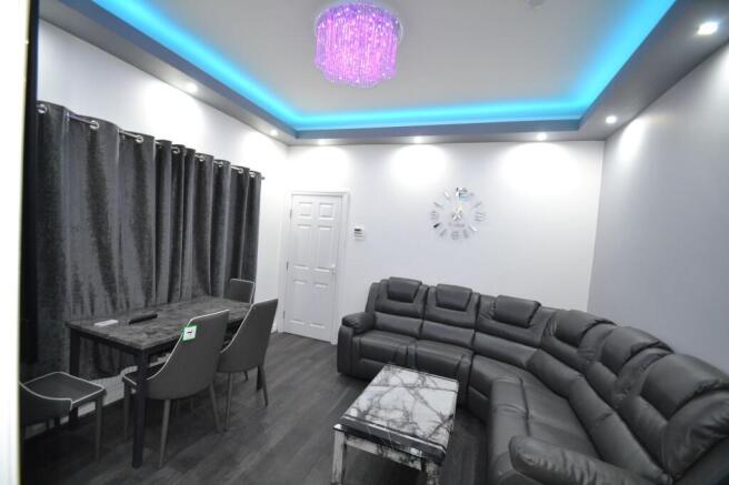 Contemporary living room with a large grey sect...