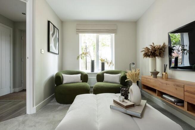 The welcoming & cosy living room is at the front of the house