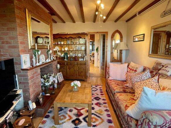 Cosy sitting room with log burner