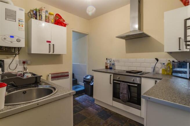 Modern kitchen with sleek white cabinets....