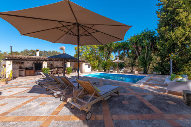 Swimming pool surrounded by spacious sun terraces