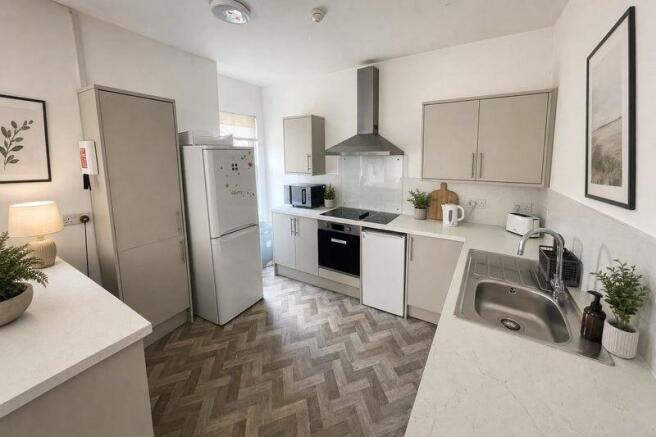 Bright modern kitchen with stylish herringbone ...