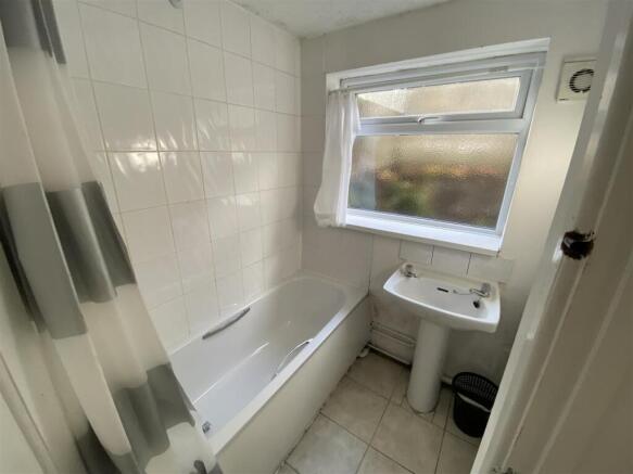 Bright bathroom with bathtub and natural light...