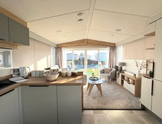 Open Plan Kitchen And Lounge With Large Front Wind