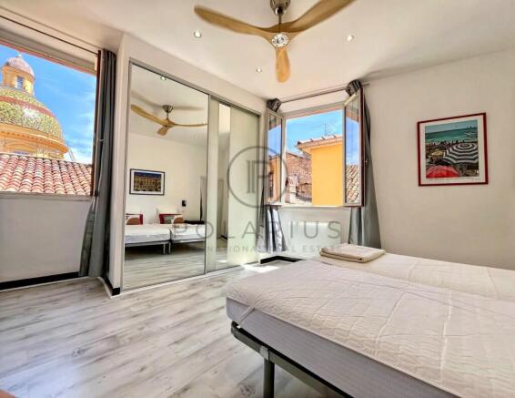 Bright and airy bedroom with large windows offerin