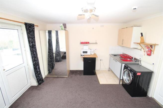 Bright studio kitchen with laundry facilities...