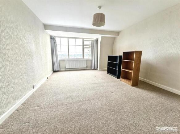 Bright, spacious room with large windows....