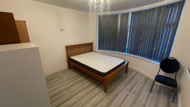 Spacious double bedroom with large bay window...