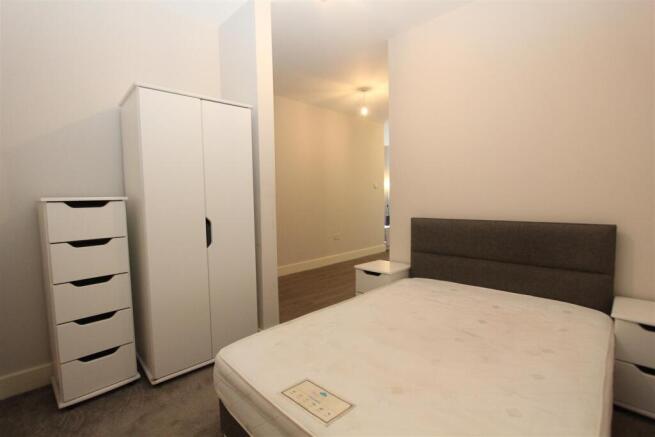 Bright double bedroom with ample storage space...