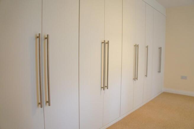 Wardrobes to bed 1