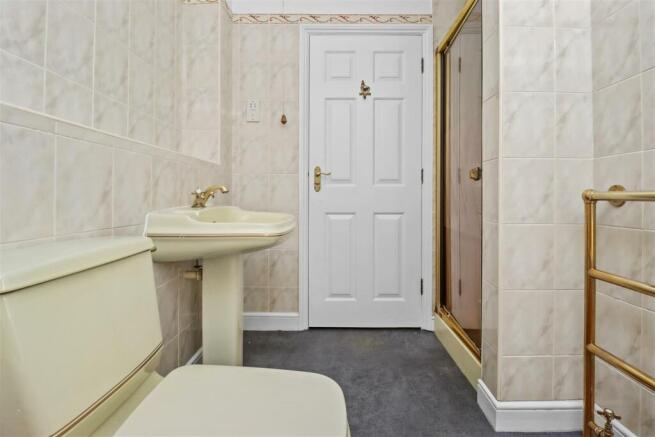 With separate shower cubicle