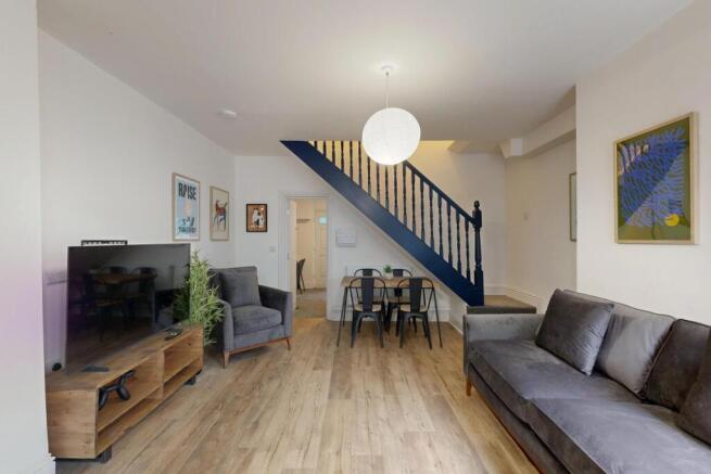 A bright, modern living room with stylish furni...
