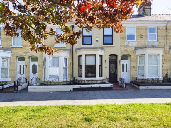 A charming exterior view of the property with w...