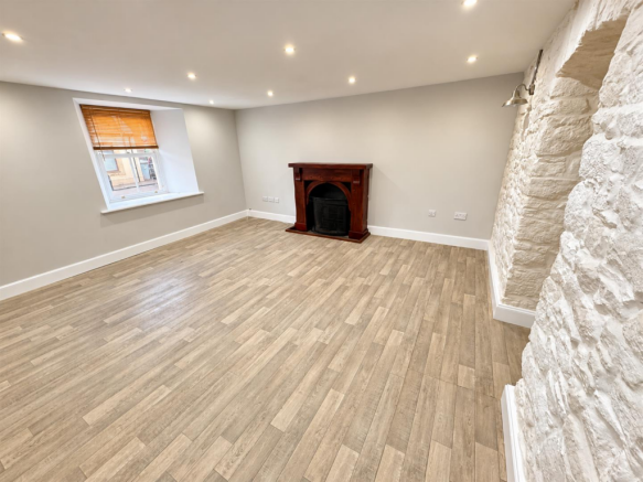 Renovated Living Room with Stone Accent.png
