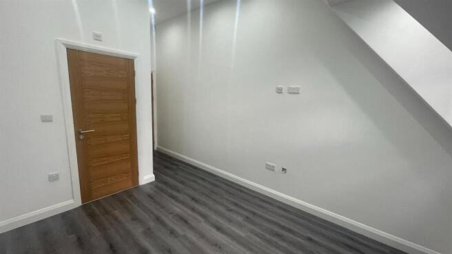 Bright, freshly painted single bedroom with mod...