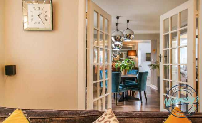 Sitting room through to family room