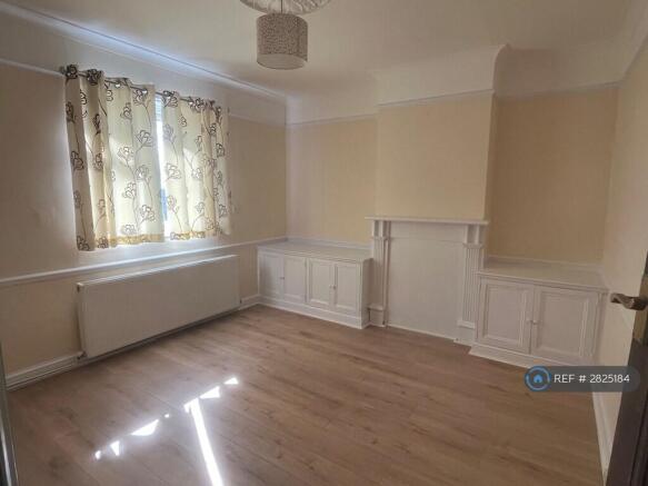 Lounge With Fire Surround And Built In Storage