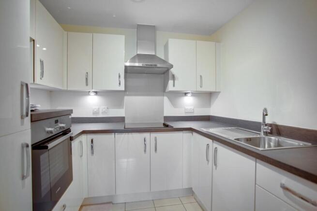 a kitchen with white cabinets