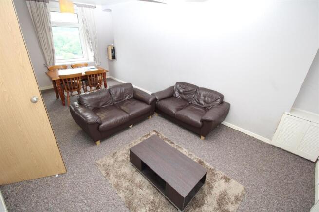 Spacious living area with comfy leather sofas...