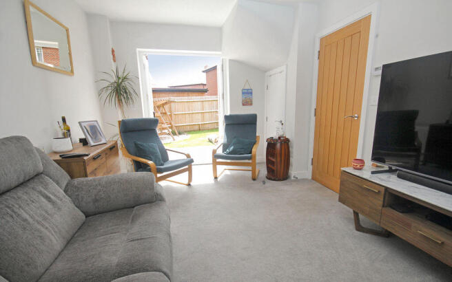 Sitting room with doors to garden