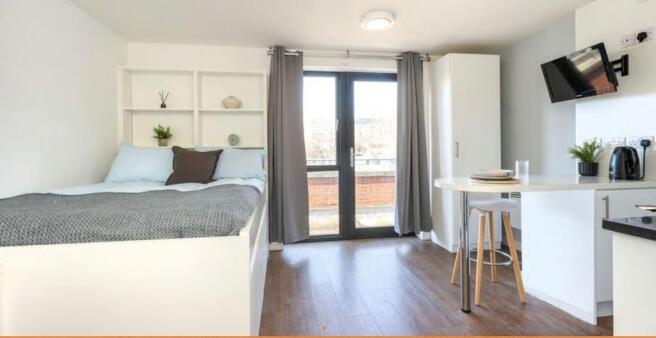 Bright modern studio with double bed and balcon...