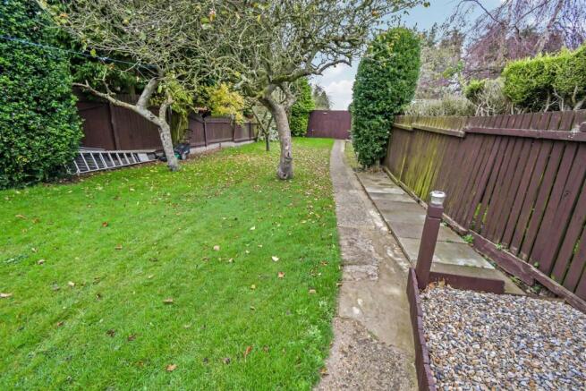 To the rear of the house
