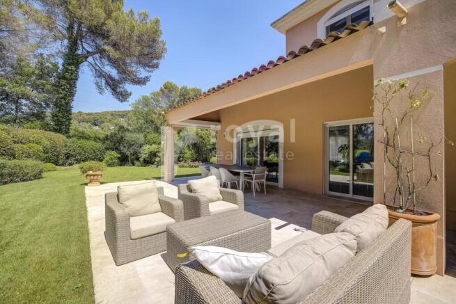 Green exterior of a large luxury contemporary vill