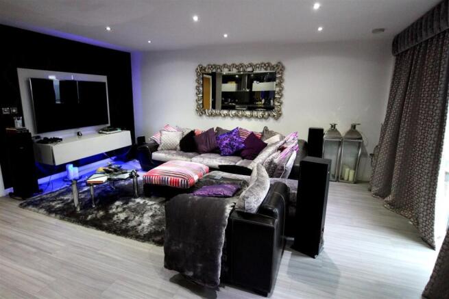 Modern lounge with plush seating and ambient LE...